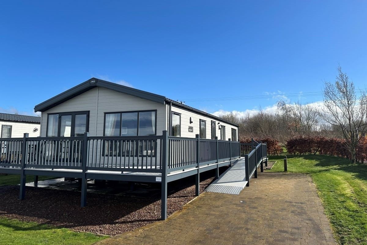 Hawthorn Brae cottage and its front garden.